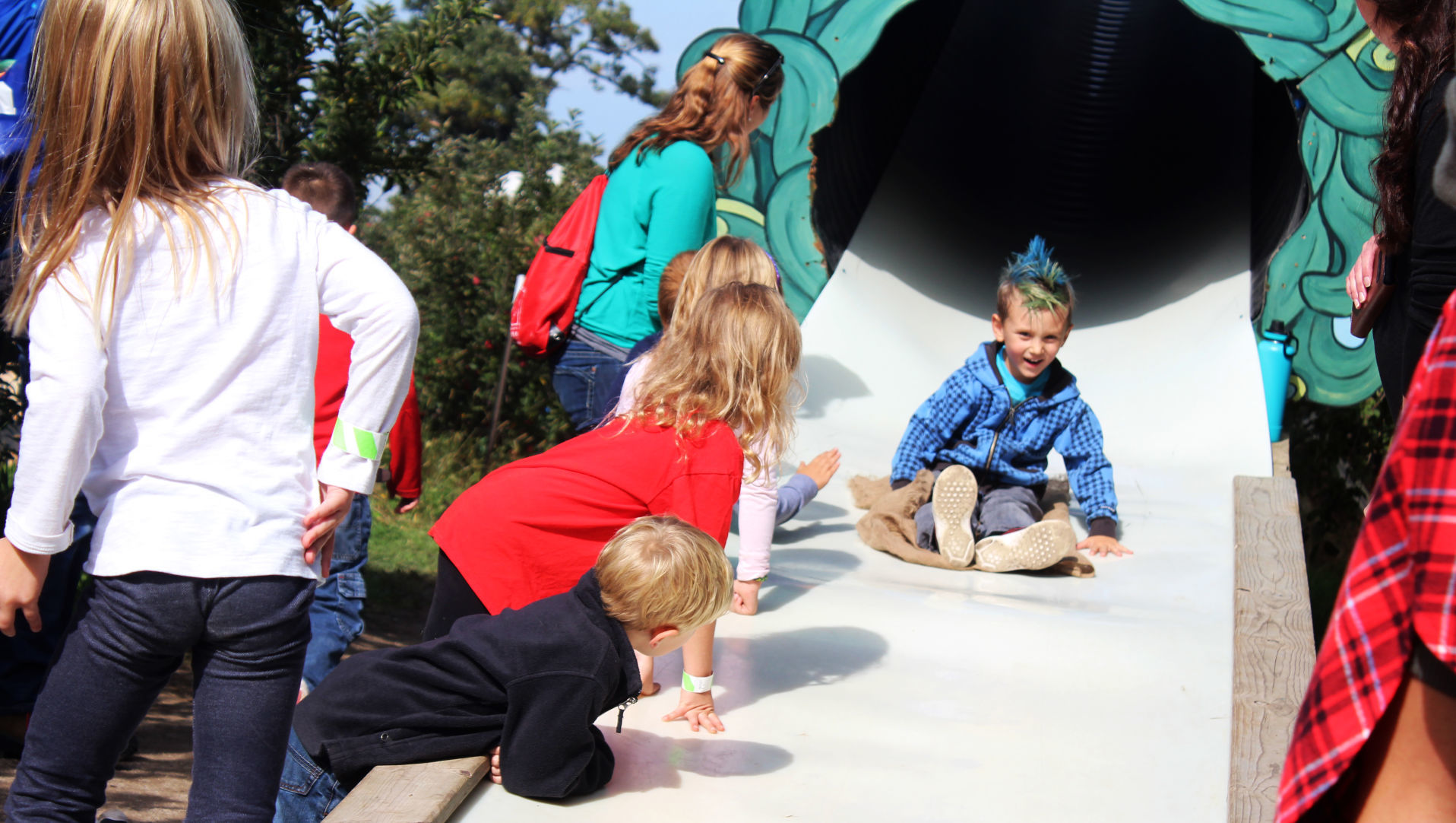 Zorin, from Mill Valley Elementary, speeds down Apple Holler's slide
